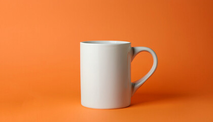 One white ceramic mug on orange background, space for text