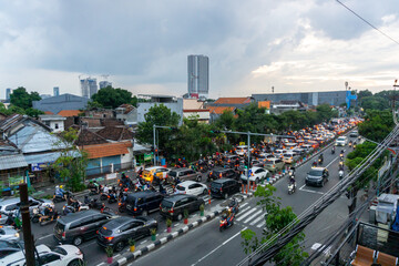 Cars and motorcycles in traffic jam at Jemur Andayani street in Suarabaya Indonesia