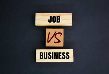 wood with the words job and business. the concept of career choice. Job vs business. concept of success