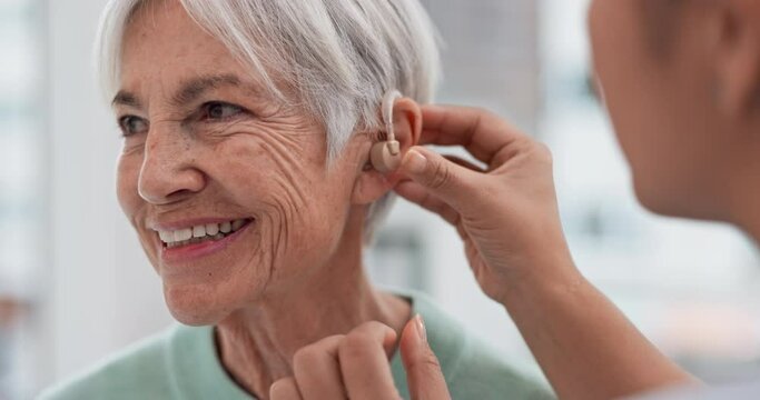 Old woman, doctor hands and patient with hearing aid, help and support with healthcare in clinic. Person with disability, deaf and people, trust and communication, health insurance and medical