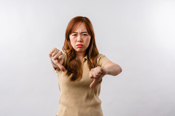 Portrait of displeased offended young Asian woman looks angrily aside doesnt agree with somebodys...