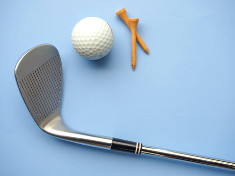 Flat lay of Golf equipments on blue background