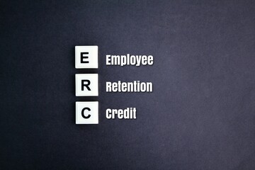 letters of the alphabet ERC or with the word Employee Retention Credit. the concept of employee salary retention