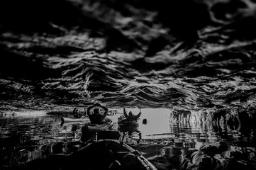 Kayaking a abandoned silica mine that is flooded with water.