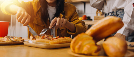 .Friends hangout. Young female celebrating birthday party at weekend at home, eating pizza, drinking champagne, party, lifestyle, friendship