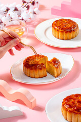 A mooncake  is a Chinese bakery product traditionally eaten during the Mid-Autumn Festival.