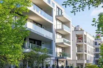 Fototapete Berlin Modern apartment buildings surrounded by greens seen in Berlin, Germany
