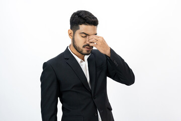 Depressed stressed. Young asian businessman on isolated white background. Angry middle aged Indian businessman in office uniform.