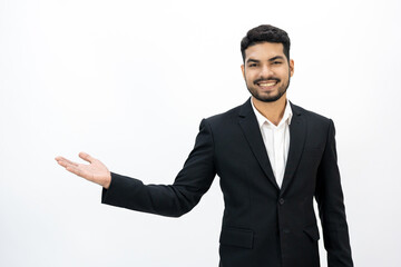 Pointing finger to blank space. Happy Young asian businessman on isolated white background. Handsome businessman in office suit uniform.