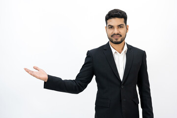 Pointing finger to blank space. Happy Young asian businessman on isolated white background. Handsome businessman in office suit uniform.