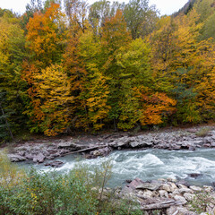 the beginning of autumn, nature walks, a mountain river and a panoramic view of the mountains, hiking trails and recreation in the mountains.