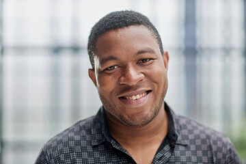 african american man in blurred office closeup
