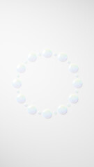 白い背景に円形に配置されたカラフルな水。水滴。（縦長）