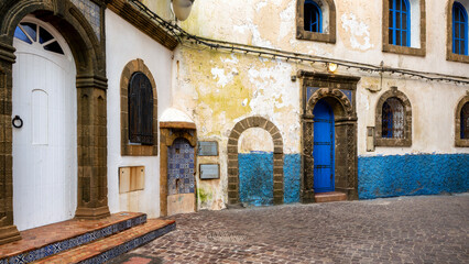 Beautiful corner on a narrow alley inside the Essaouira Medina. Colorful houses of Morocco....