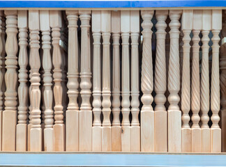 Balusters in the store. Shopping for baluster in DIY shop. Carved balusters for the wooden staircase to the second floor.