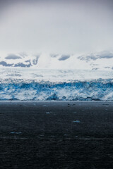 Cruise to Hubbard Glacier Bay in Alaska with floating ice bergs and drift ice floes on ocean water...