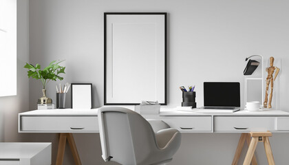A creative workspace featuring a desktop computer and a white work table with an empty poster frame