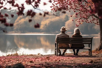 Foto op Plexiglas Serene Autumn Scene: Back View of Senior Couple Enjoying Life After Retirement on Bench in Picturesque Park, Gazing at the Tranquil Lake, Embracing a Healthy and Active Lifestyle © Tony