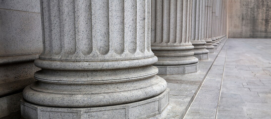 Stone colonnade and stairs detail. Classical pillars row in a building facade