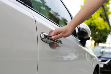 Male hand opening car door