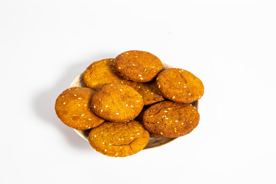 Indian Homemade Cookies on plate, white background, bunch of cookies