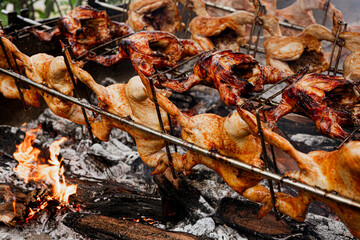 Huli-huli chicken is a grilled chicken dish in Hawaiian cuisine, prepared by barbecuing a chicken over mesquite wood, Prosopis pallida , kiawe