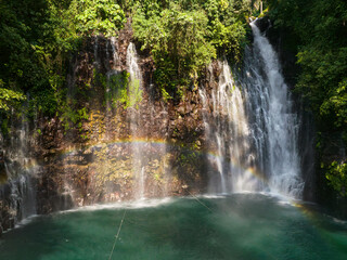 Tinago Falls with rainbow. Lanao del Norte. Mindanao, Philippines. Summer and travel concept.