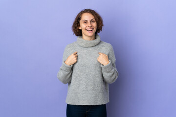 Young English woman isolated on purple background with surprise facial expression