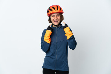 Young English cyclist woman isolated on white background giving a thumbs up gesture
