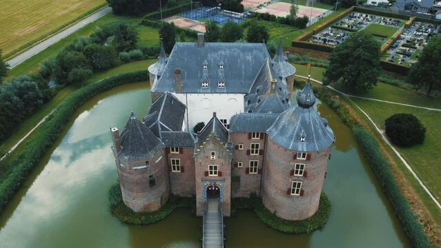 Ammersoyen castle: aerial view traveling in to the entrance to the beautiful castle and seeing the bridge and the moat that surrounds it. In the Netherlands on a sunny day in July.