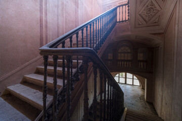 frescoed stairs in an abandoned villa