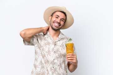 Young caucasian man holding a cocktail isolated on white background laughing