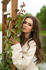 beautiful girl with long hair posing outdoors.