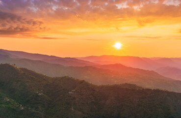 summer scenery mountain view from a highland hill to a beautiful sunset.
