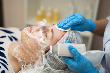 close-up of a girl's face at a cosmetologist during treatment procedures