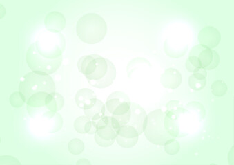 明るい緑のキラキラ丸背景