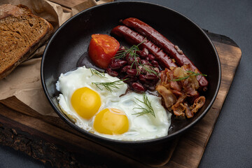 Delicious breakfast. eggs fried in a pan. Close-up
