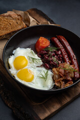 Delicious breakfast. eggs fried in a pan. Close-up