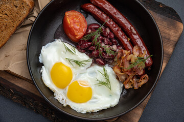 Delicious breakfast. eggs fried in a pan. Close-up