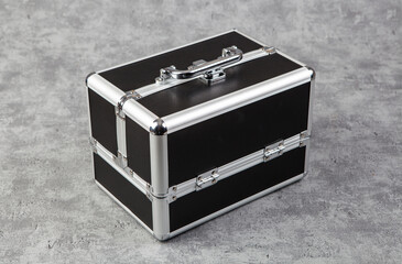 Metal case for tools on a gray background. Close-up.