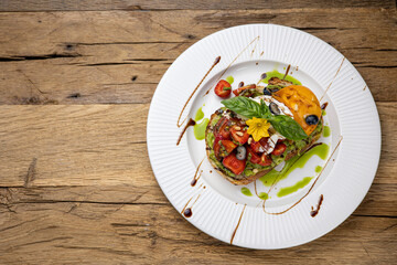 Сrouton with avocado, tomatoes and basil. 