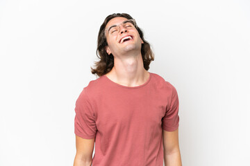 Young handsome man isolated on white background laughing