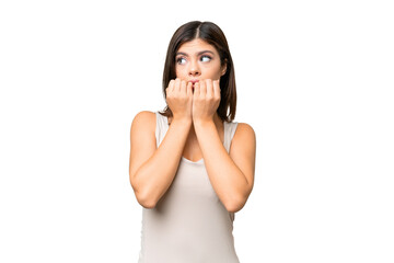 Fototapeta premium Young Russian woman over isolated chroma key background nervous and scared putting hands to mouth