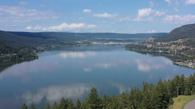 Unveiling Williams Lake's beauty through drone footage on a bright summer day accentuates the allure of British Columbia, Canada