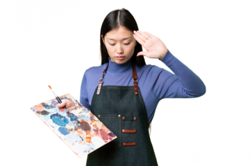 Young artist woman holding a palette over isolated chroma key background making stop gesture and disappointed