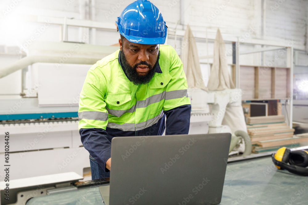 Poster portrait of a male engineer operating a computer, designing and controlling a machine. in the furnit