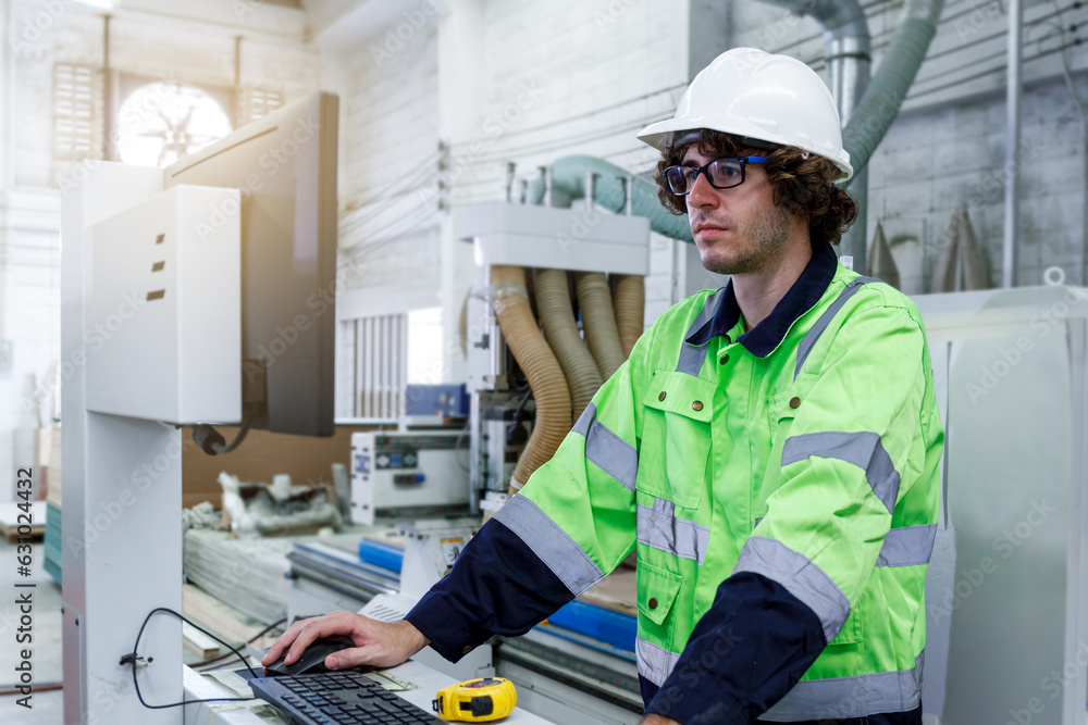 Poster portrait of a male engineer operating a computer, designing and controlling a machine. in the furnit