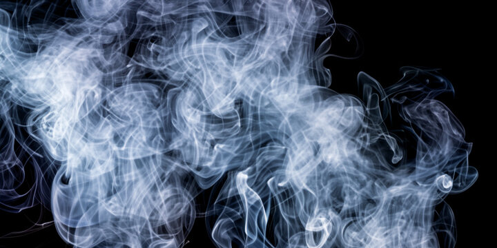 immagine con volute di fumo denso su sfondo scuro, full frame