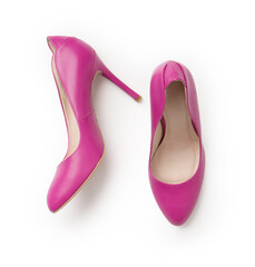 Elegant women's summer leather pink stilettos. A new pair of shoes on a white background.