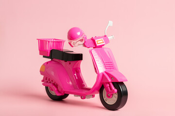 Pink vintage toy doll scooter or motorbike with helmet on pastel pink background. 80s, classic, retro style